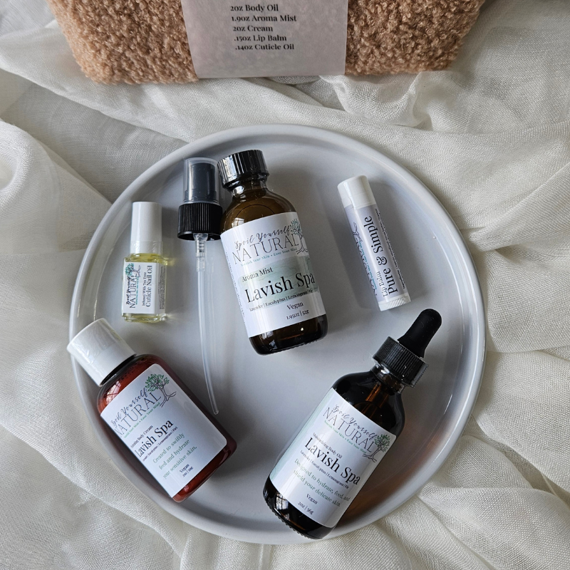 Collection of Lavish Spa products on a white plate with a beige fabric background