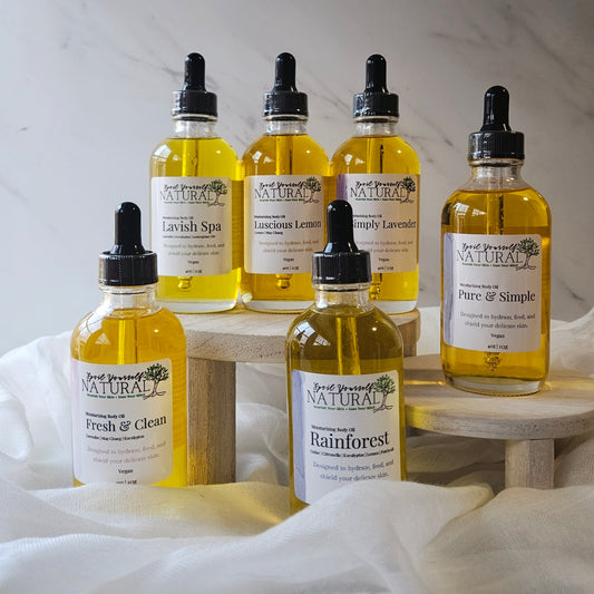 Collection of 'Soul Yourself Natural' skincare product bottles on a white surface with a neutral background.