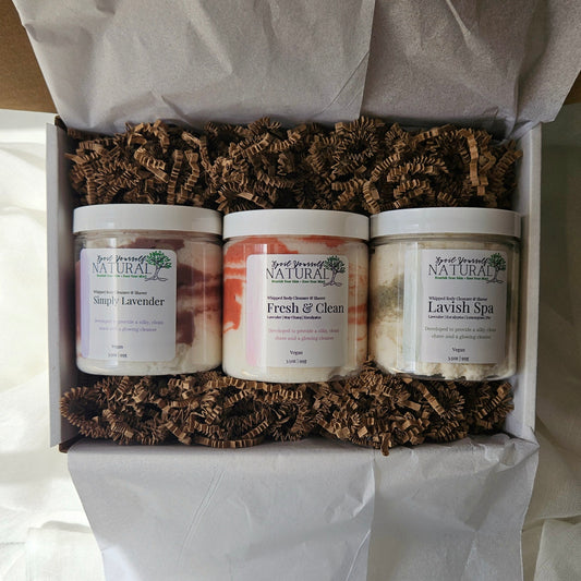 Three cleansers in a box with decorative paper