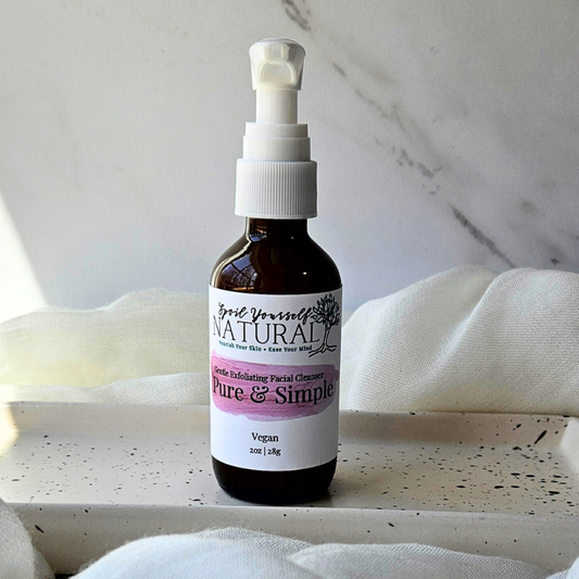 a bottle of gentle exfoliating facial cleanser on a white dish