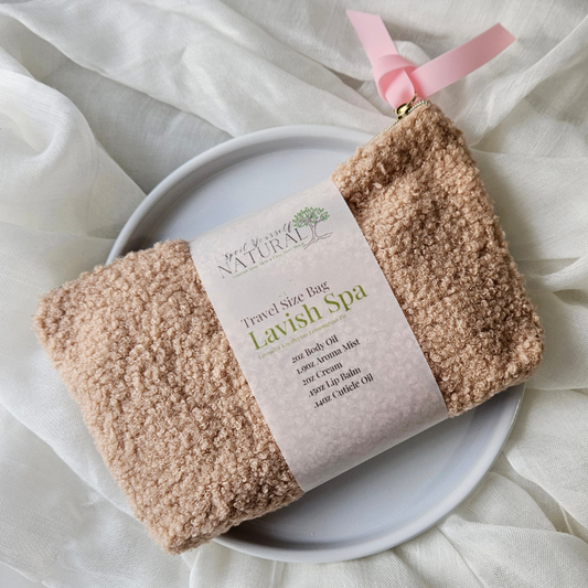 Travel size bag with 'Lavish Spa' products on a white plate